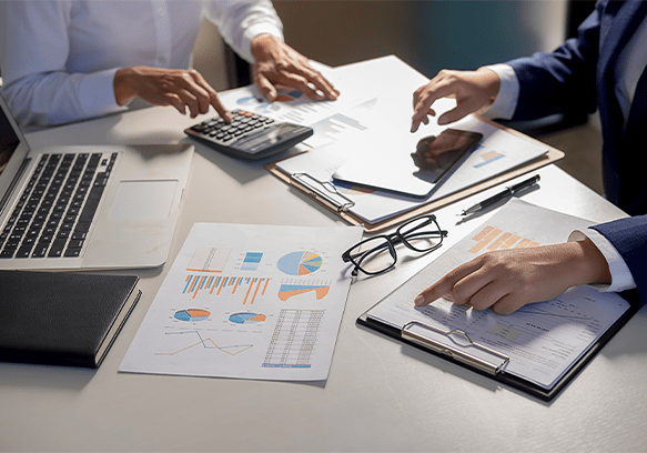 Business team reviewing finance reports on a smart dashboard.